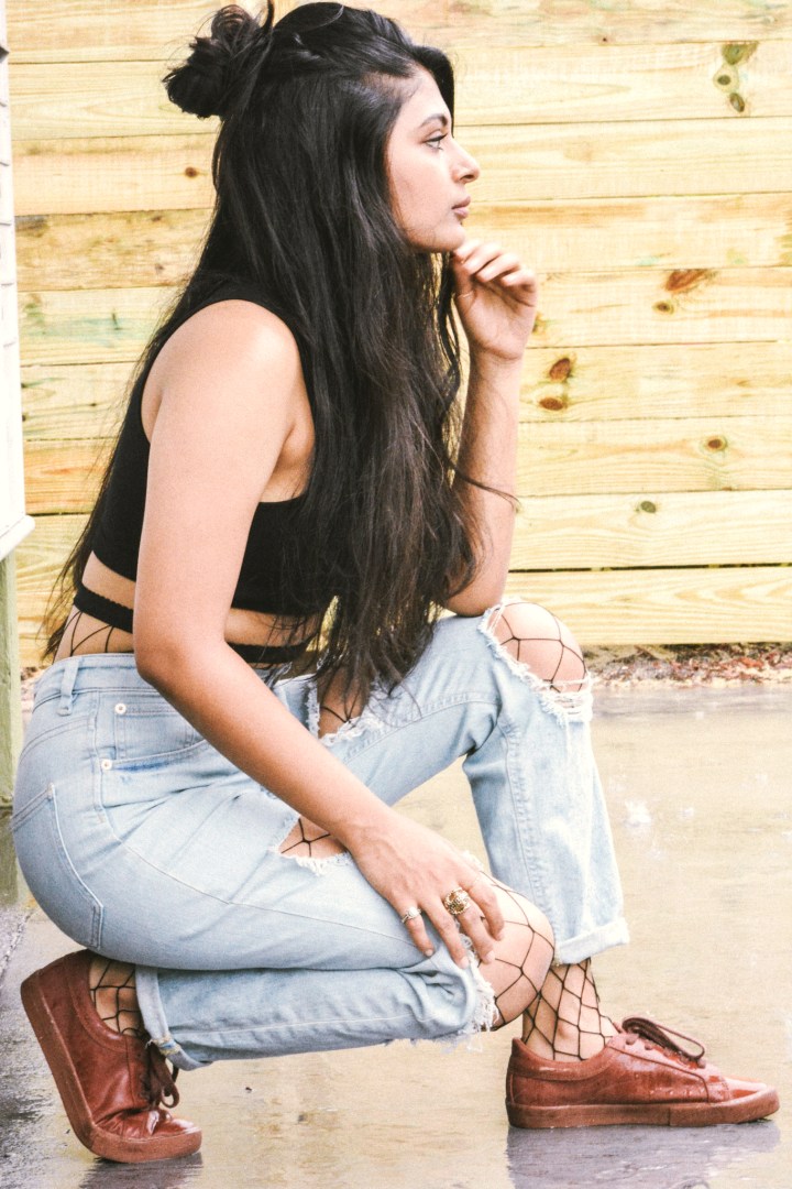 fishnets under ripped jeans