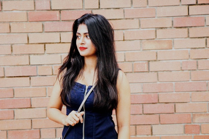 denim dress red lips middle parted hair